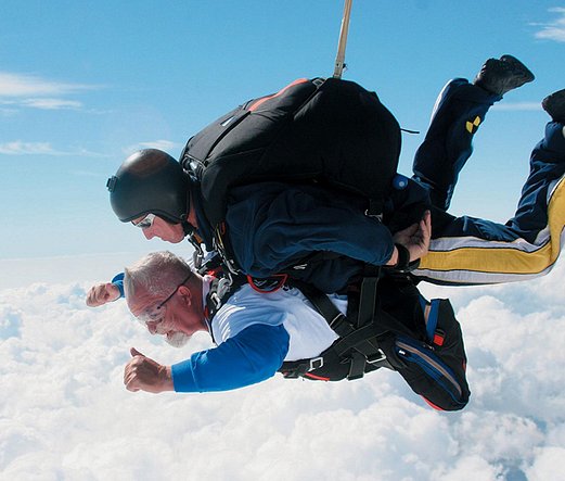 Jay Stokes takes double amputee combat veteran skydiver on a jump using accessible tandem harness.